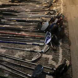 Golf Clubs Pool Sticks And A Couple Tennis Rackets