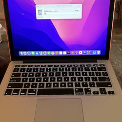 MacBook Pro with case and charger