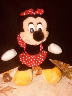 Minnie Mouse with polka-dot dress with matching bow. 12 inches in good condition. Disneyland