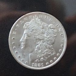 1881 **CC** Morgan Silver Dollar + Carson City
