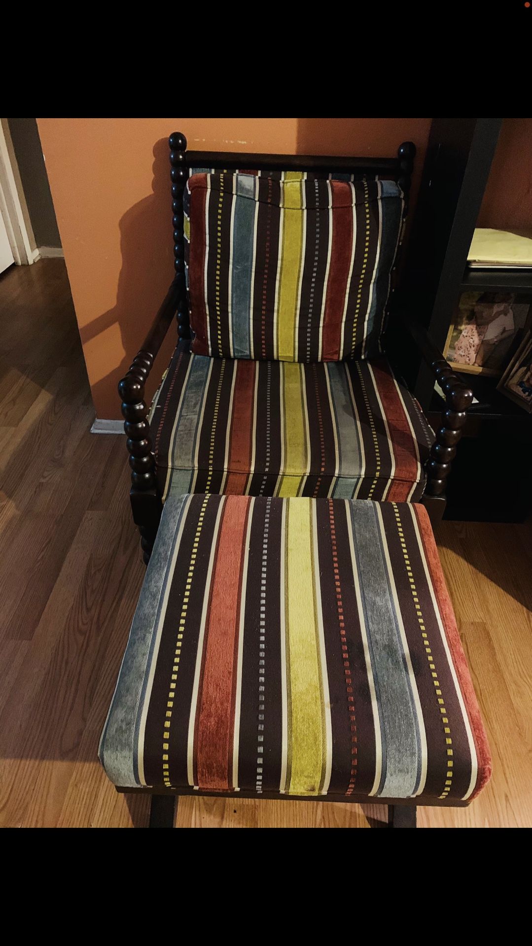 Accent chair with extra footstool.