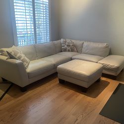 Beige L- Shaped Leather Sectional Sofa With Ottoman
