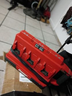 This is a Bauer 20V 6-Port Sequential Charger (Item 58673).It features six sequential charging ports and two USB-A ports for device charging.The unit 