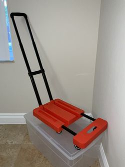 Convertible hand cart package cart. 6 wheels rotate 360 degrees.  Pull handle collapses and stores inside platform.  Adjustable length base.