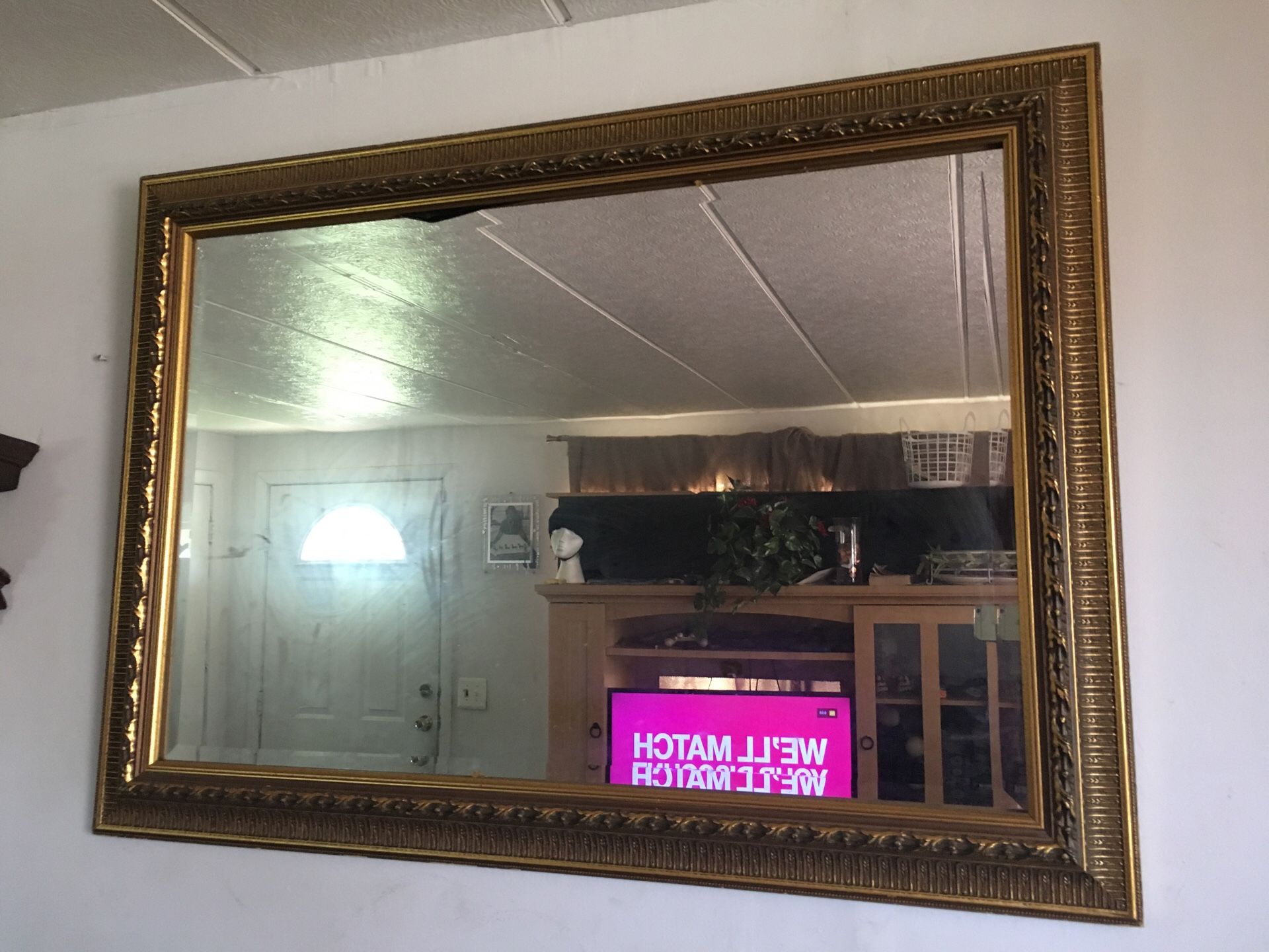 Gold frame mirror 42in w 29L with wall decor