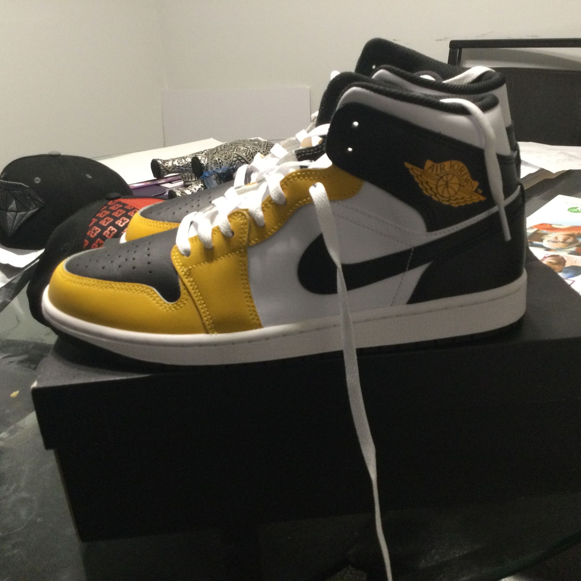 Jordan one mids yellow and black