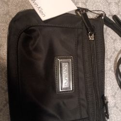 This is a Calvin Klein Belfast Nylon Key Item Small Crossbody bag in black. 