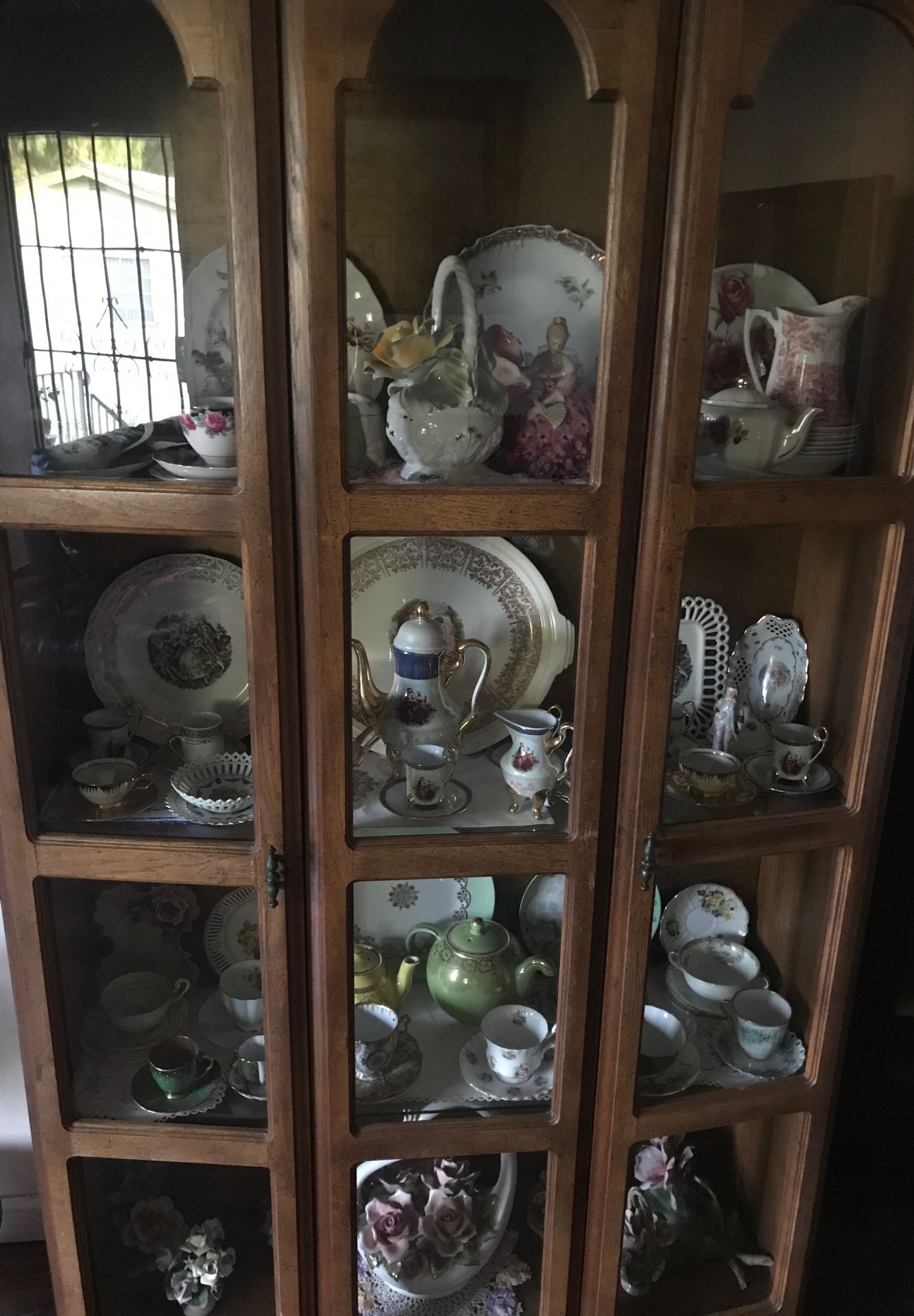 Antique china cabinet with my collection of tea cups English, German, Capadamante ....