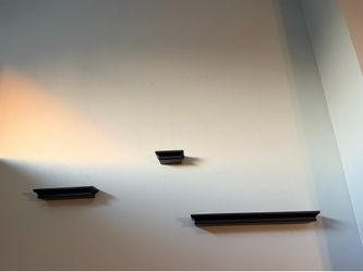 3 black floating shelves