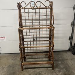 1960s Mid-Century Modern vintage rattan étagère featuring a three-tiered design