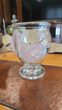 Glass vase with light pink roses