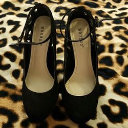 Black suede pumps
