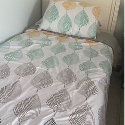 Twin bed with small dresser
