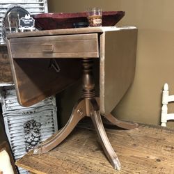 Ross gold accent antique table with claw legs.