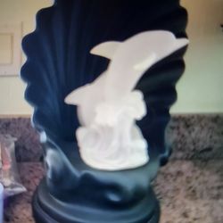 Lamp.
One is a mermaid, 1 is dolphins.They light up and turn around.They can either stay on as a lamp or they light up and go around in circles and th