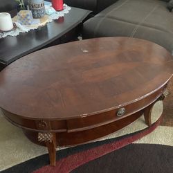 $135-Beautiful  (scratched) coffee table with storage drawer and extra storage shelf underneath  4’ X 2 1/2’ yes it is scratched from use as it is use