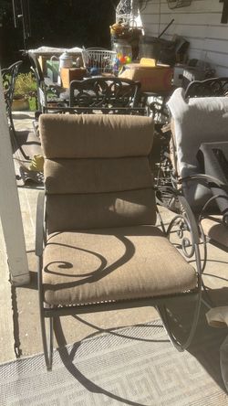 Outdoor wrought iron rocking chair.
