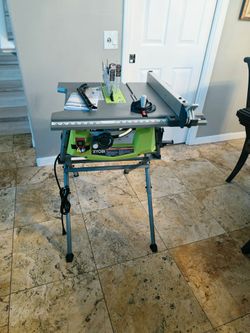 Ryobi 15 Amp 10 in. Compact Portable Corded Jobsite Table Saw with Folding Stand.(Open box never use
