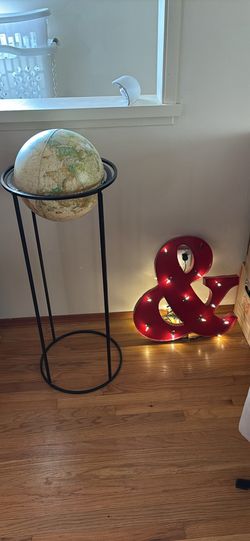 Globe and light up ampersand sign