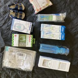 Baby items bottles swaddle clothes 