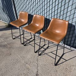 Three leather counter stools 24"