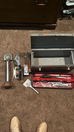 Tool box filled with carpet tool supplies