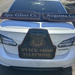 Three handmade wooden golf signs in good condition.   One says spy glass Court,  one says Augusta Court  and the third one says telephone in pro shop.