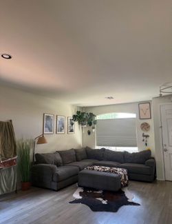 Brown sectional with charging ports and ottoman