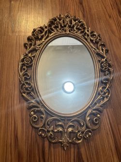 Gold ornate mirror