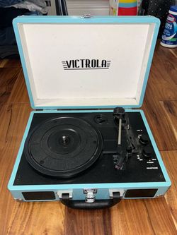 Victrola Portable Suitcase Record Player and 3 Ariana grande vinyls