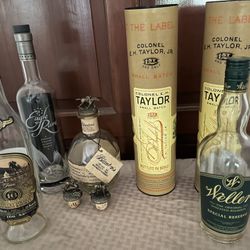 Empty Bourbon Bottles And Stoppers