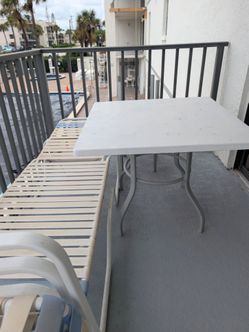 1 Lounge chair, 1 table, 2 side table, 4 chairs