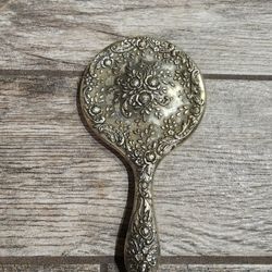 Vintage Art nouveau hand held mirror with ornate floral design