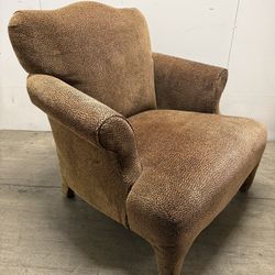 Leopard chair also has a foot stool