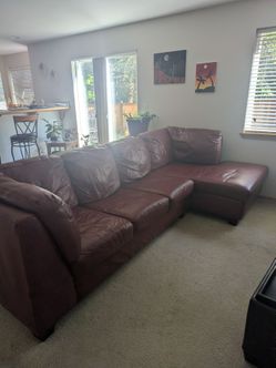 Red leather "L" shaped couch