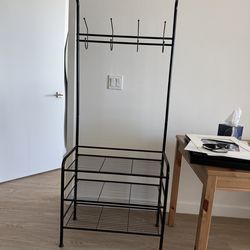Black metal shoe rack