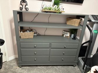 Dresser. Entertainment center. Cabinet shelf.