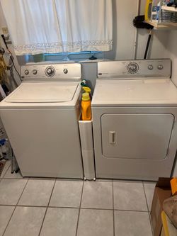 Two side-by-side Maytag Centennial, washer and dryer top loader with large cabinet. $500 for both
