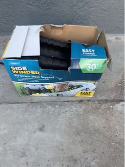 Rv sewer hose support