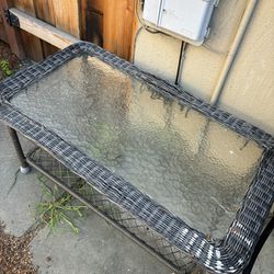 NEGOTIABLE glass metal wnd wicker outdoor coffee table.
