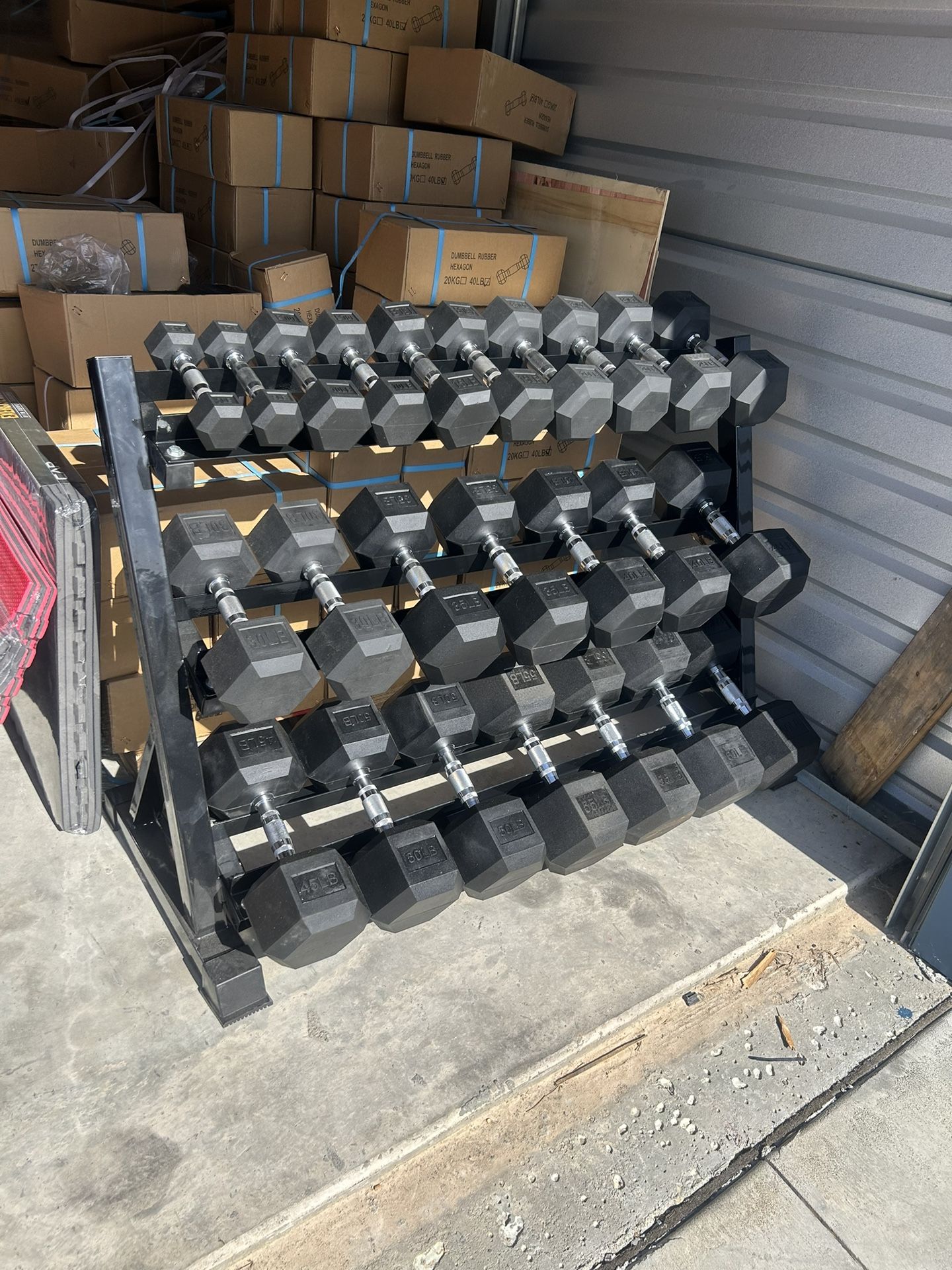 New pair of 5,10,15,20,25,30,35,40,45,50, 55,60lb rubber dumbbells + rack. All new in box $880