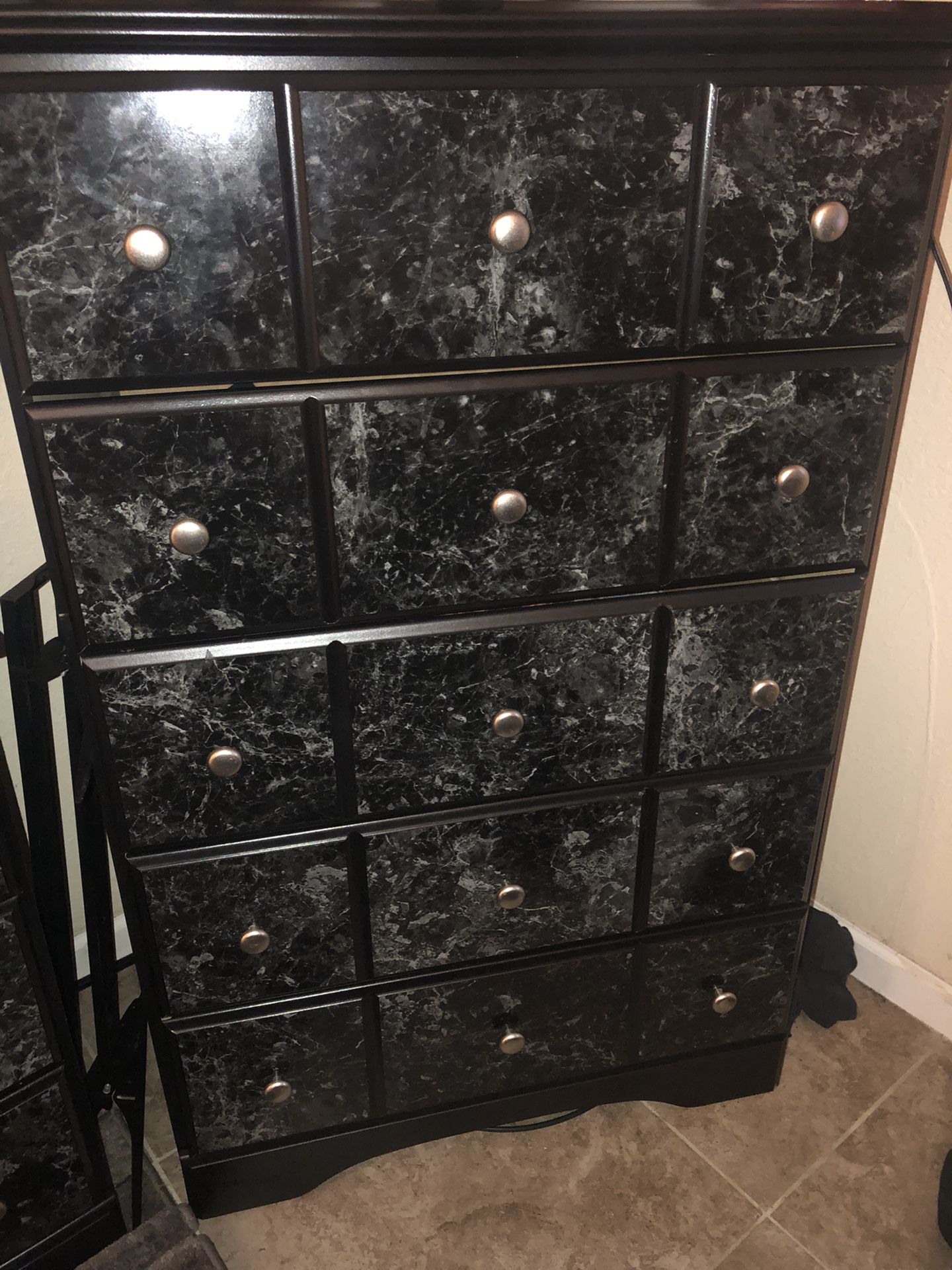 Black and white marble bedroom set.  Comes with 2 Night Stands A Chester And A Dresser. 