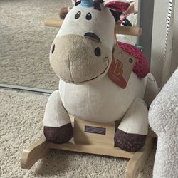 wooden rocking unicorn with soft plushy seat