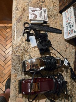 Includes clippers, comb, scissors, and instructions.