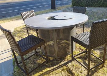 Outdoor patio counter height fire pit table with 4 chairs