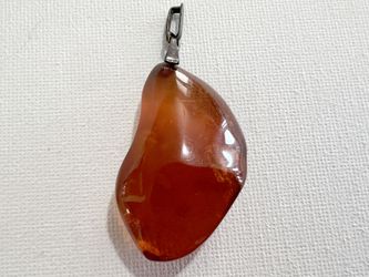 Polished cherry amber pendant