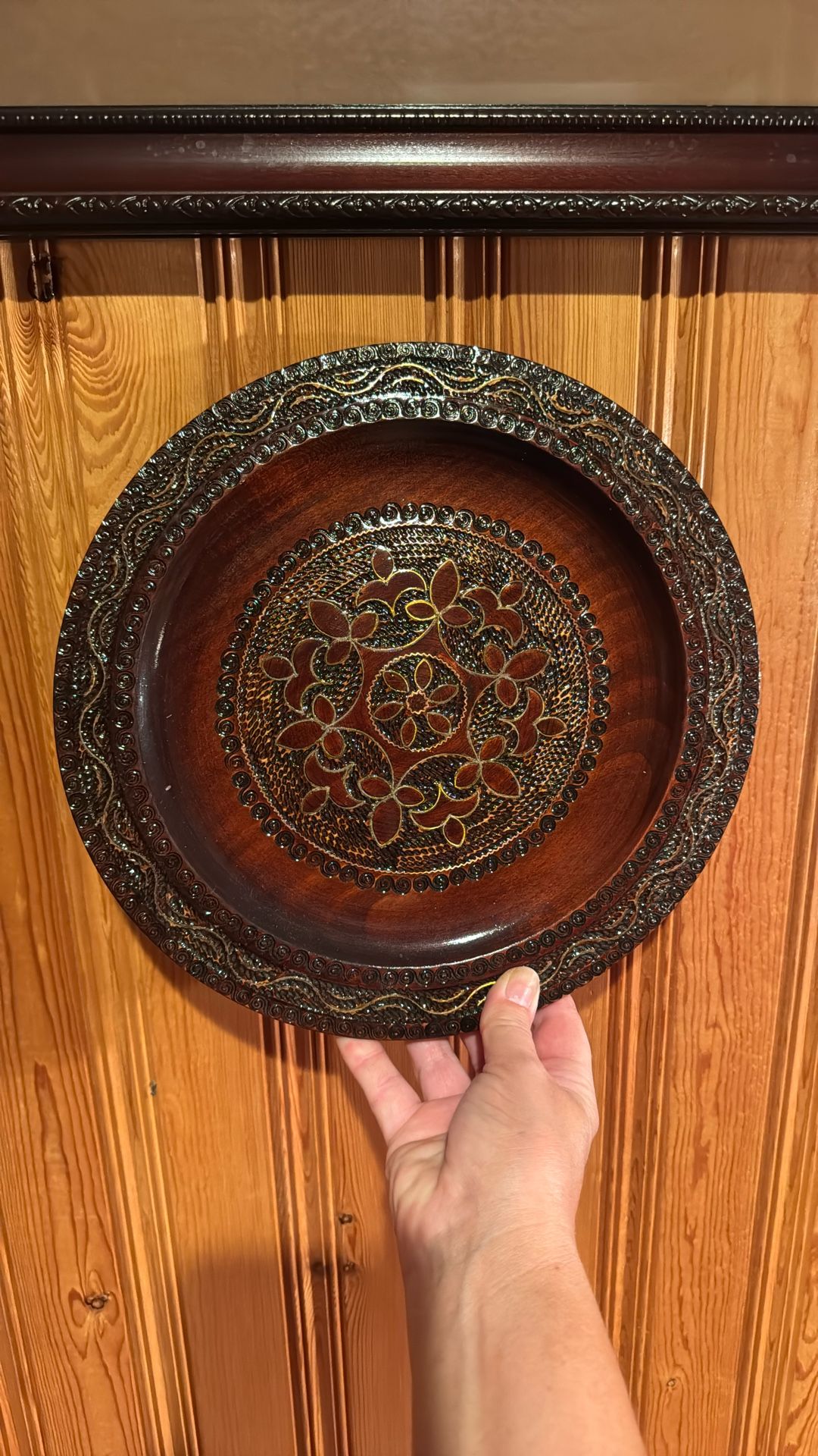 Wooden hand-carved decorative plate