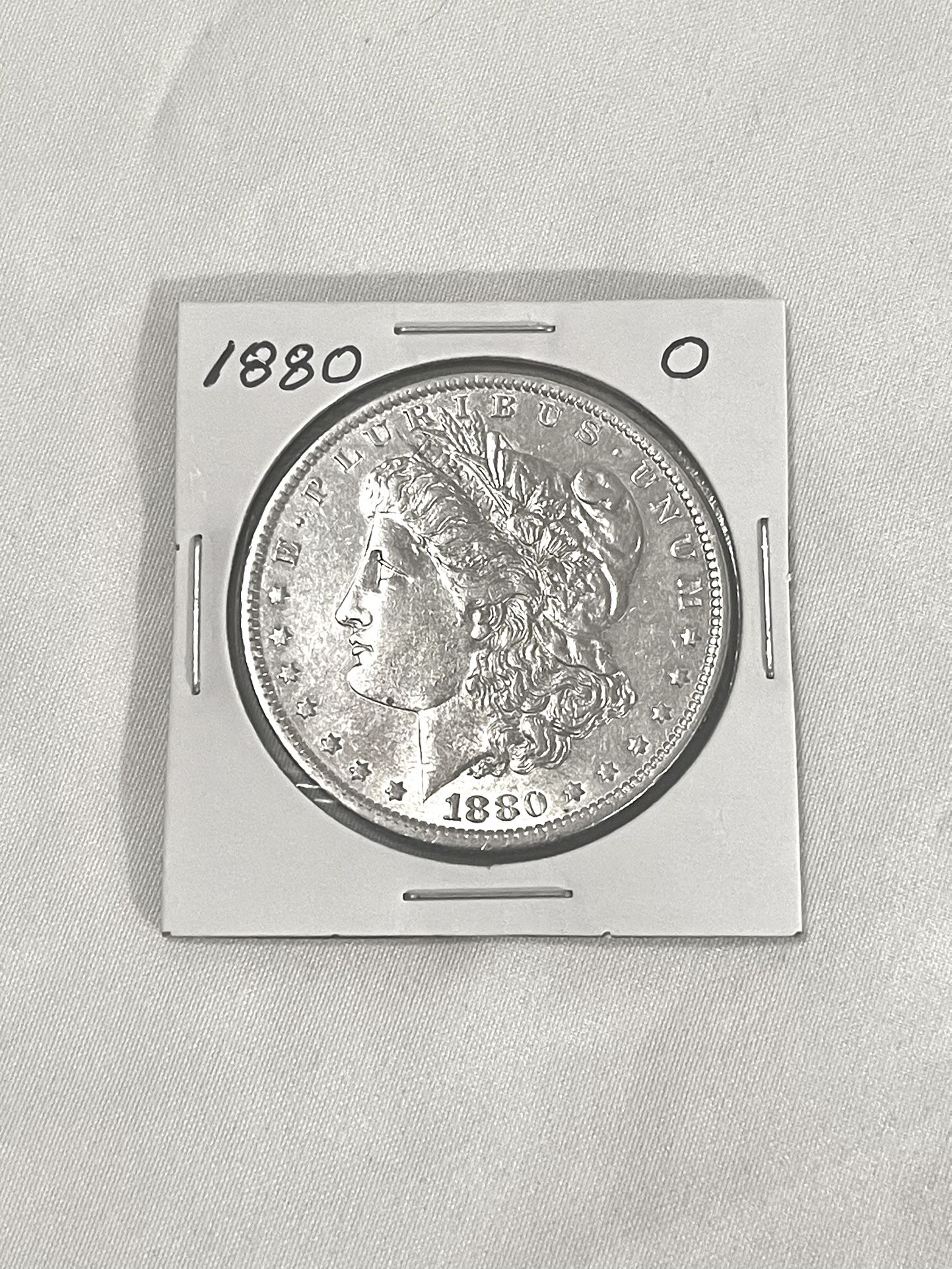 About Uncirculated-AU(50)  1880-O Morgan Silver Dollar. Valued At $72 On Us Coin Book in this condition