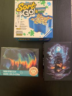 New 2 500 piece puzzles and organizer trays