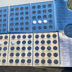 set of Whitman coin folders, designed for collecting specific U.S. coins like state commemorative quarters